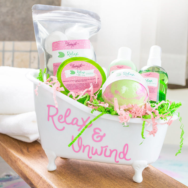 Bathtub gift basket with luffa soap, body spray, lotion, bath bomb, and shower steamers 