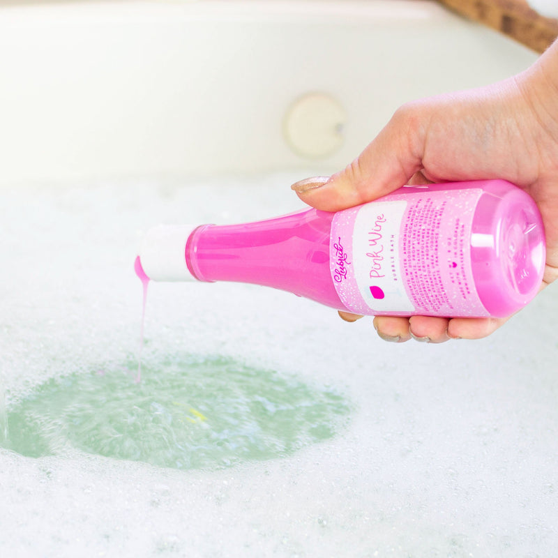 Pink Wine Bubble Bath poured into bubbly bath water